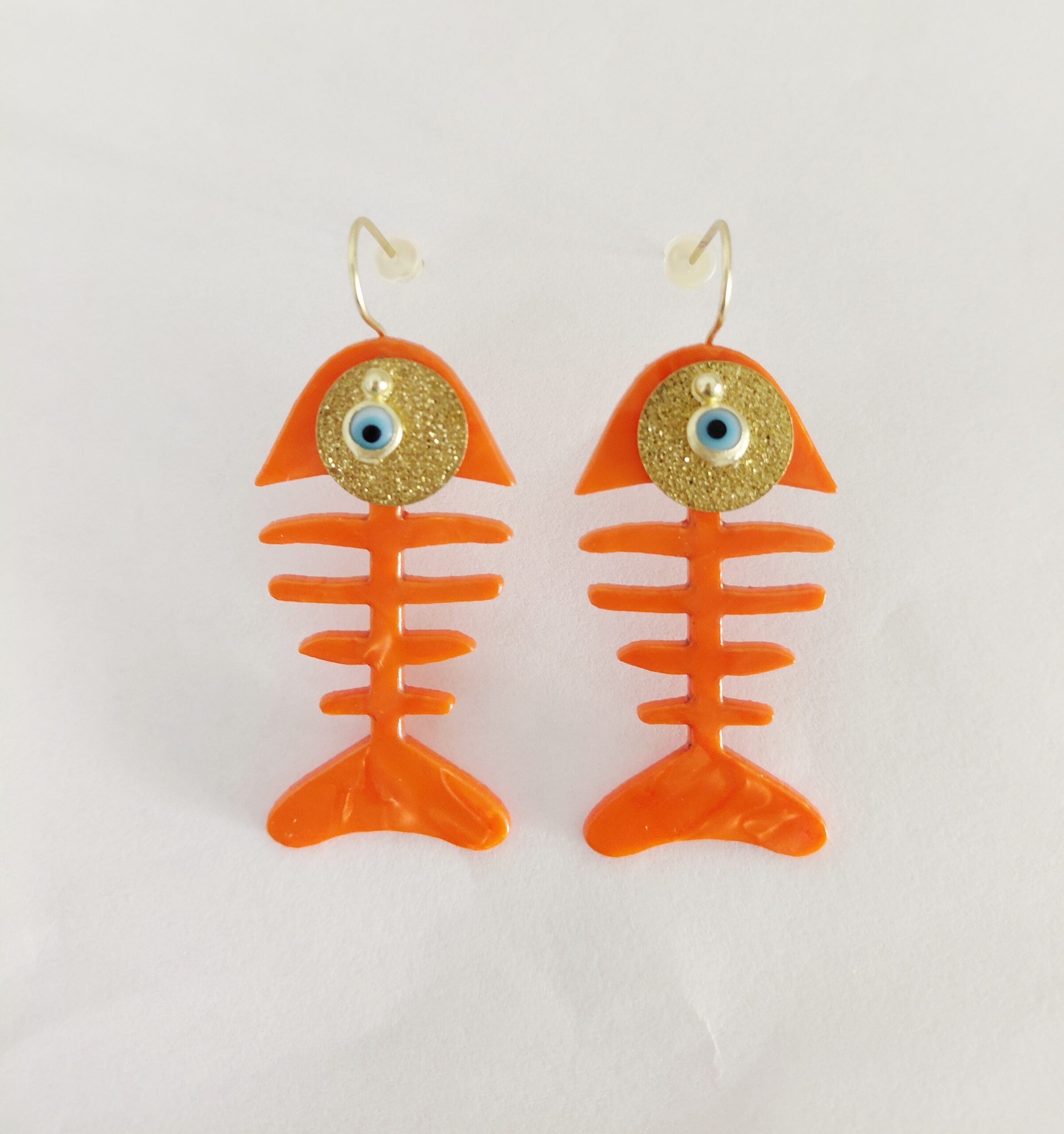 Pendientes raspa naranja nacarada.